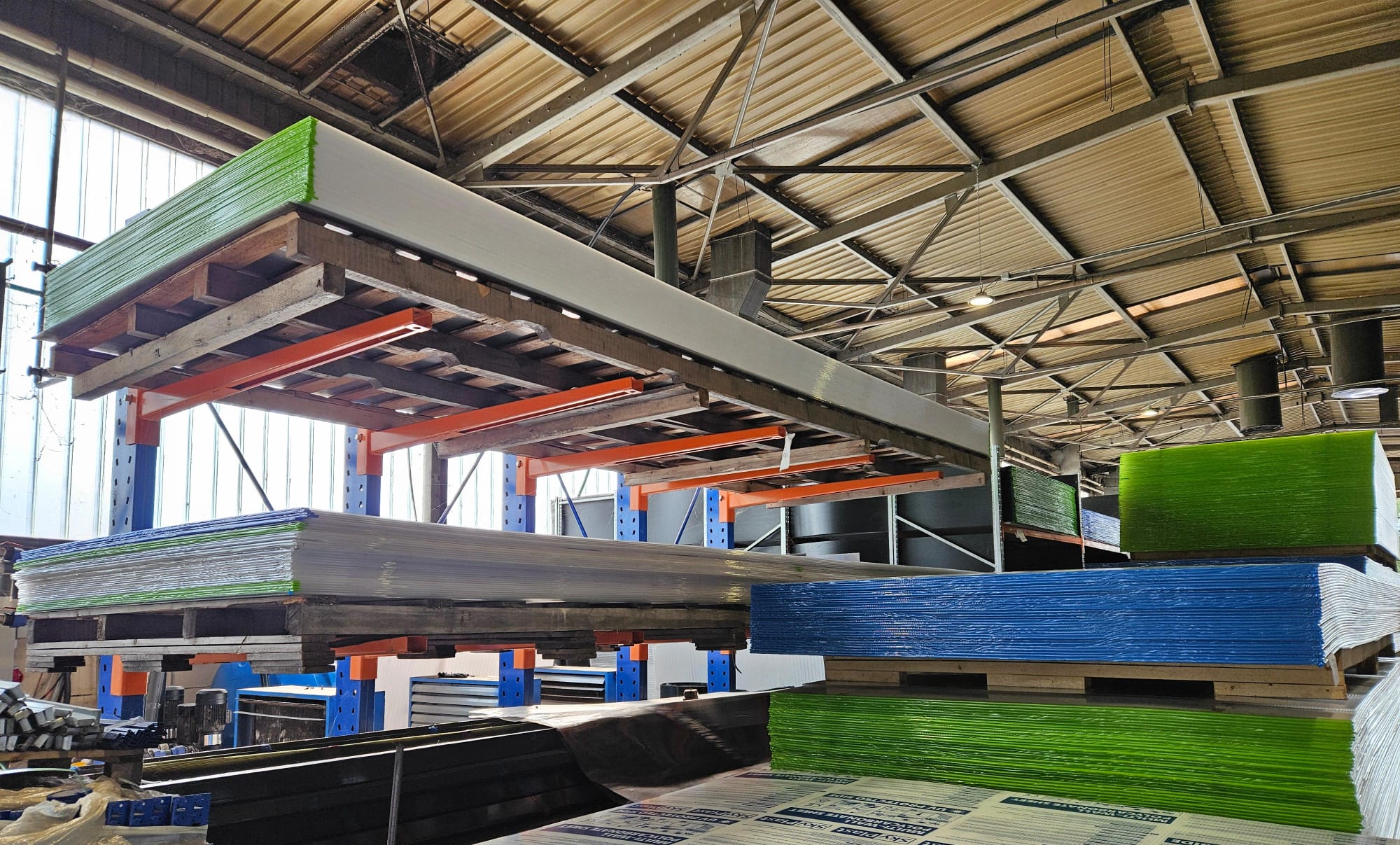 Stacked polycarbonate sheets in factory